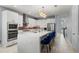 Well-equipped kitchen with an island, stainless appliances, modern lighting, and plentiful storage at 14399 Wabasso Loop, Winter Garden, FL 34787