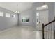 Bright living room with tile floors, neutral walls, and large windows at 14399 Wabasso Loop, Winter Garden, FL 34787