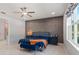 Comfortable bedroom featuring an accent wall, stylish decor, and plenty of natural light at 14399 Wabasso Loop, Winter Garden, FL 34787