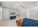 Bright bedroom showcasing a large window, modern furnishings, and neutral decor at 14399 Wabasso Loop, Winter Garden, FL 34787