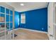 Bright blue office space with a hardwood floor and french door entry at 14399 Wabasso Loop, Winter Garden, FL 34787