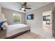 Comfortable bedroom with a ceiling fan and natural light at 14410 Lake Underhill Rd, Orlando, FL 32828