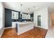 Modern kitchen with stainless steel appliances and a center island with pendant lighting at 14410 Lake Underhill Rd, Orlando, FL 32828
