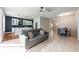 Open concept living space featuring a modern sofa and tiled floors at 14410 Lake Underhill Rd, Orlando, FL 32828