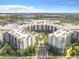 Stunning aerial view of the community with a lake and lush landscaping at 14501 Grove Resort Ave # 3601, Winter Garden, FL 34787