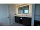Elegant bathroom with double sink vanity, modern lighting, and contemporary fixtures at 14501 Grove Resort Ave # 3601, Winter Garden, FL 34787