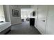 Comfortable bedroom with carpet floors and a television at 14501 Grove Resort Ave # 3601, Winter Garden, FL 34787