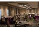 An event room with tables elegantly set for a special occasion, featuring a projector screen at 14501 Grove Resort Ave # 3601, Winter Garden, FL 34787