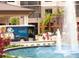 Hotel exterior shows shuttle bus, fountain, and Gathering walking towards the entrance at 14501 Grove Resort Ave # 3601, Winter Garden, FL 34787