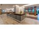 Hotel lobby with stylish front desk, modern lighting, and comfortable seating areas at 14501 Grove Resort Ave # 3601, Winter Garden, FL 34787