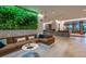 Modern hotel lobby boasts a living wall and plush seating for guests at 14501 Grove Resort Ave # 3601, Winter Garden, FL 34787