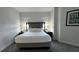 Well-lit bedroom with a comfortable queen-sized bed, bedside tables, and modern decor at 14501 Grove Resort Ave # 3601, Winter Garden, FL 34787
