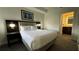 Cozy bedroom with a comfortable bed, ambient lighting, and stylish artwork at 14501 Grove Resort Ave # 3601, Winter Garden, FL 34787