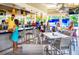 Inviting restaurant features island bar, casual seating, and nearby surfing simulator at 14501 Grove Resort Ave # 3601, Winter Garden, FL 34787