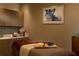 A relaxing spa room with massage table, cabinet, and sink with vanity provides a tranquil setting at 14501 Grove Resort Ave # 3601, Winter Garden, FL 34787