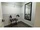 Bright walk-in closet with hanging racks, modern wood-look flooring, and a convenient luggage rack at 14501 Grove Resort Ave # 3601, Winter Garden, FL 34787