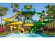 Towering waterpark structure featuring colorful slides and a refreshing splash pool, surrounded by lush tropical foliage at 14501 Grove Resort Ave # 3601, Winter Garden, FL 34787