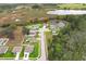 Aerial view of a subdivision featuring a scenic location with a pond and conservation area at 15216 Langsdale Ct, Mascotte, FL 34753