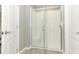 Modern bathroom features a sleek glass-enclosed shower and neutral paint color at 15216 Langsdale Ct, Mascotte, FL 34753