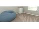Bedroom featuring a large beanbag and a five-drawer dresser next to a window at 15216 Langsdale Ct, Mascotte, FL 34753
