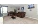 Entertaining bonus room with comfortable seating and table at 15216 Langsdale Ct, Mascotte, FL 34753