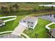 Charming two-story home features a well-manicured lawn and a pond view at 15216 Langsdale Ct, Mascotte, FL 34753