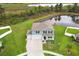 Beautiful two-story home with a well-manicured lawn and picturesque pond view at 15216 Langsdale Ct, Mascotte, FL 34753
