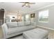 Spacious living room showcasing an open floor plan and comfortable seating at 15216 Langsdale Ct, Mascotte, FL 34753