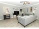 Inviting living room with wood-look flooring and stylish decor at 15216 Langsdale Ct, Mascotte, FL 34753