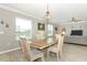 Comfortable living room featuring natural light and flows into the dining area at 15216 Langsdale Ct, Mascotte, FL 34753