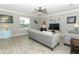 Comfortable living room featuring a large window and neutral color palette at 15216 Langsdale Ct, Mascotte, FL 34753