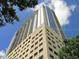 Angled exterior shot of a modern high-rise condo building showing the windows and architectural design at 155 S Court Ave # 1613, Orlando, FL 32801