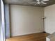 Empty living room featuring hardwood floors, a modern ceiling fan, and neutral paint at 155 S Court Ave # 1613, Orlando, FL 32801