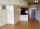 Bright living room featuring wood floors and an open layout with kitchen view at 155 S Court Ave # 1613, Orlando, FL 32801