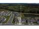 Aerial view of home with a pond and greenery in the neighborhood at 17398 Saw Palmetto Ave, Clermont, FL 34714