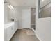 Clean bathroom featuring a walk-in shower and a white vanity with modern fixtures at 17398 Saw Palmetto Ave, Clermont, FL 34714