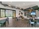 Stylish clubhouse with modern furnishings, a TV, and a cozy lounge area at 17398 Saw Palmetto Ave, Clermont, FL 34714