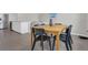 View of the dining area, attached kitchen, and living area, showcasing an open floor plan and tiled floors at 17398 Saw Palmetto Ave, Clermont, FL 34714