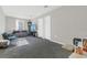 Bright living room with a comfortable sofa, TV, and lots of space at 17398 Saw Palmetto Ave, Clermont, FL 34714