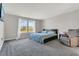Serene bedroom featuring a comfortable bed, large windows, and neutral tones at 17398 Saw Palmetto Ave, Clermont, FL 34714