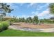 Community playground with modern equipment and a safe, cushioned ground surface at 17398 Saw Palmetto Ave, Clermont, FL 34714