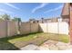 The backyard features a well-maintained lawn and tall fencing for privacy and security at 1836 N Crystal Lake Dr # 104, Lakeland, FL 33801