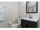Bathroom featuring a modern vanity with a dark wood cabinet, and toilet at 1836 N Crystal Lake Dr # 104, Lakeland, FL 33801