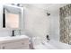 Modern bathroom with white tiled walls, updated fixtures, and a shower-tub combination at 1836 N Crystal Lake Dr # 104, Lakeland, FL 33801