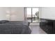 Cozy bedroom with wood floors, large window, sleek dresser and neutral tones to make the room feel warm and inviting at 1836 N Crystal Lake Dr # 104, Lakeland, FL 33801