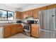 Kitchen with oak cabinets, stainless steel appliances and lots of natural light at 1836 N Crystal Lake Dr # 104, Lakeland, FL 33801