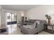 A cozy living room with a gray sofa, stylish tables, and large windows for plenty of natural light at 1836 N Crystal Lake Dr # 104, Lakeland, FL 33801