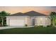 Charming single-story home features a two-car garage, well-manicured lawn and beautiful sunset views at 1887 Groveline Rd, St Cloud, FL 34771