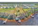 Large waterfront lot with mature trees and a home with a boathouse and dock on the water at 18951 Lake Pickett Rd, Orlando, FL 32820