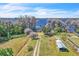 Large waterfront lot featuring mature trees, lake access, and a small shed in the backyard at 18951 Lake Pickett Rd, Orlando, FL 32820
